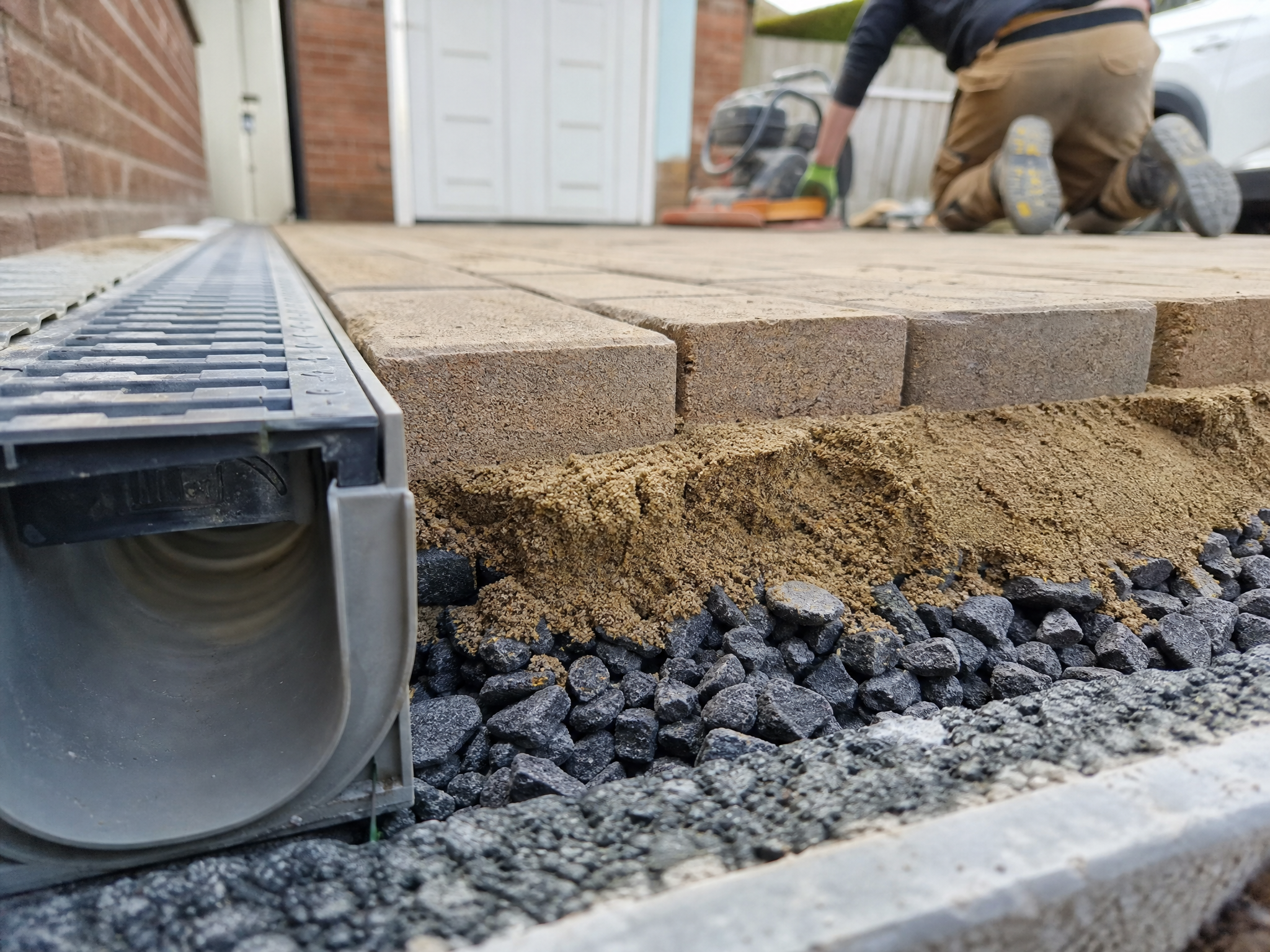 Close-up detail of materials and technique used in driveway groundwork & drainage — showing quality