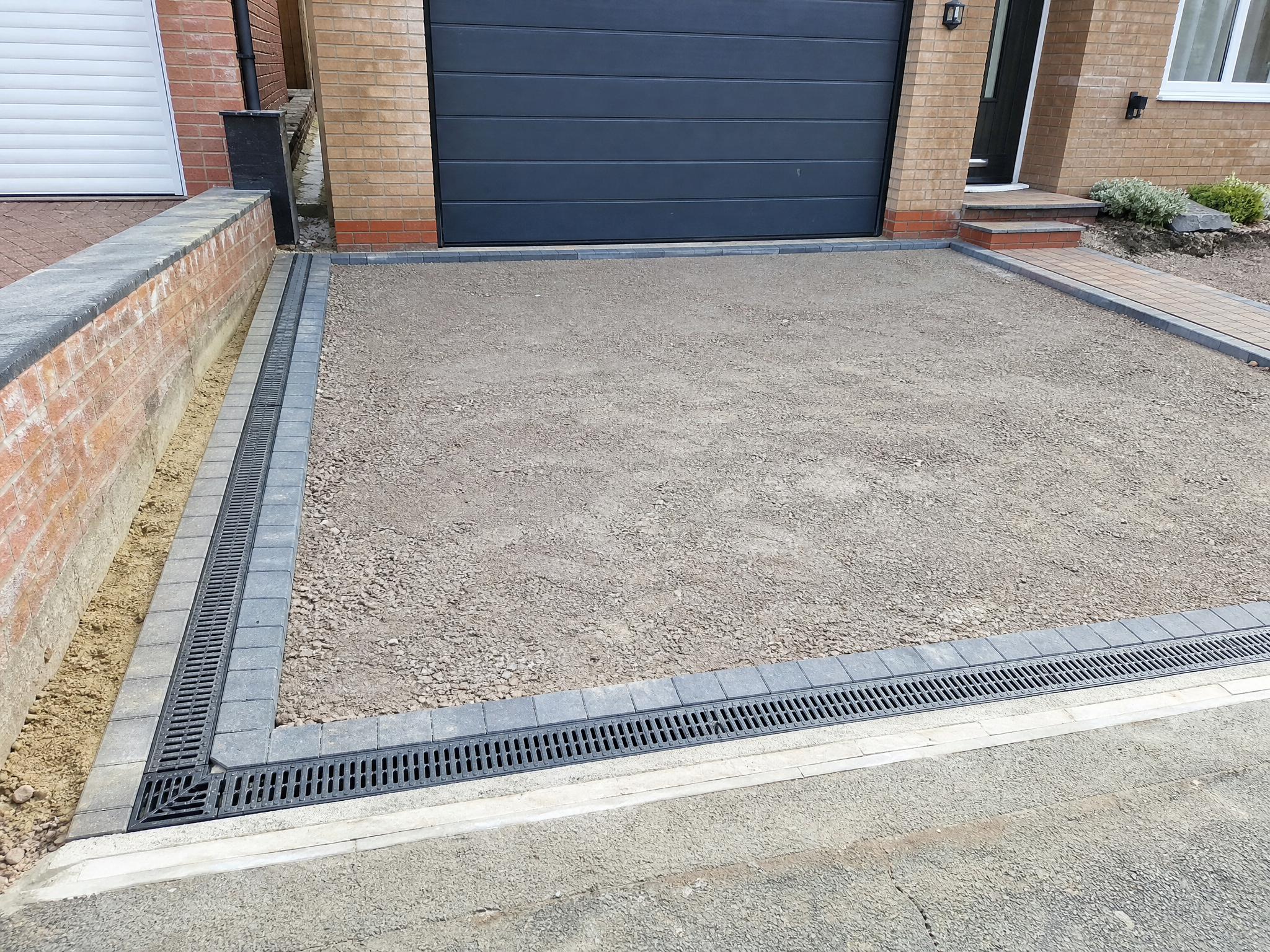 Completed driveway groundwork & drainage showing professional quality workmanship in a British home