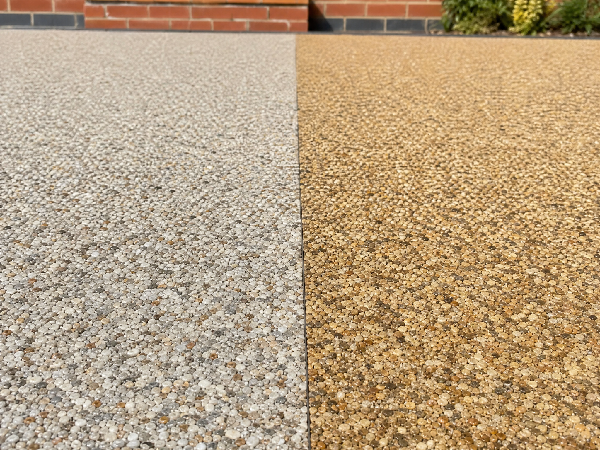Resin driveway where clean UV-stable resin meets older non-UV resin that has turned yellow
